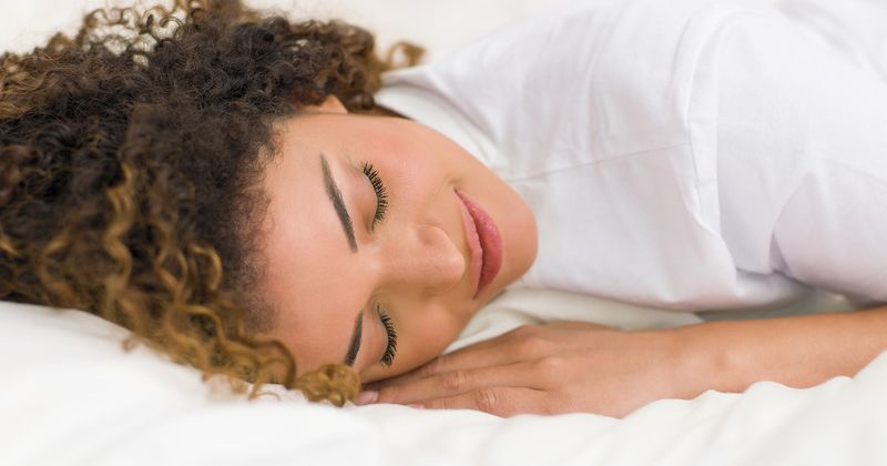 Build a Faster Metabolism While Sleeping - Lady Resting After a Workout.