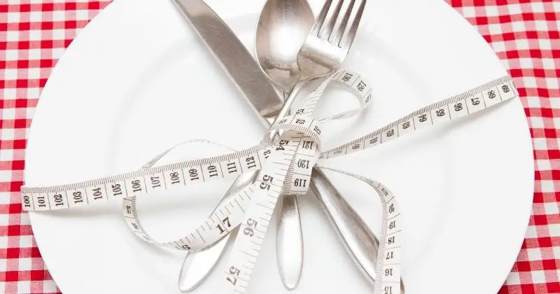 - Doctors Weight Loss - Eating Utensils Wrapped in Measuring Tape