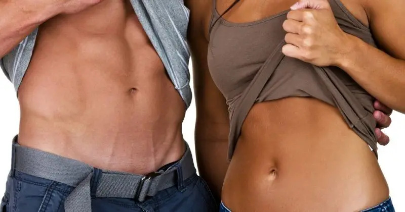 Best Supplements to Slim Down your Stomach - a man and a woman showing their fit abs