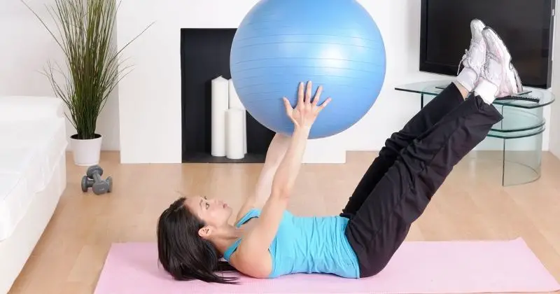 Weight Loss at Home for Female Beginners - woman exercising with a ball