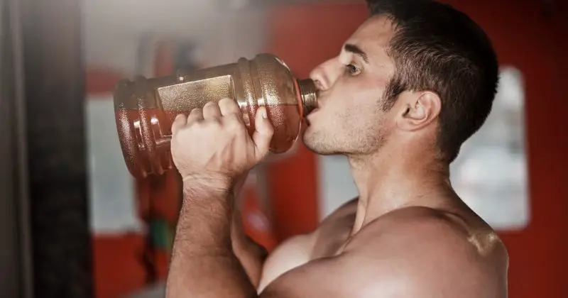 Pre-Workout - A man drinking a pre-workout