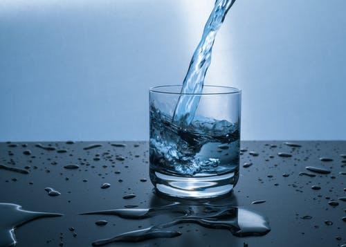 Lose Weight Without Cardio -a glass of water being poured