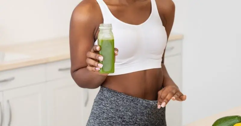 Lose Weight Without Cardio - woman drinking green juice