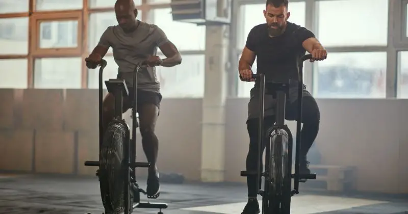 Home Workout Plan - two men on stationary bikes