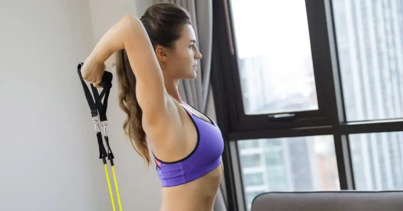 Triceps Workout – Woman doing a triceps workout with resistance bands