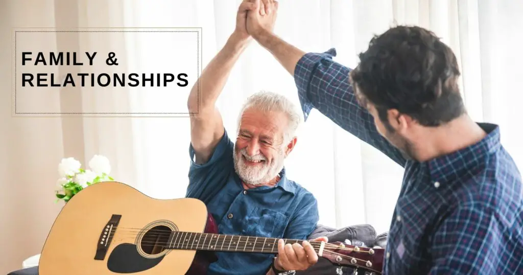 Family Relationships

Father playing guitar with his hand in son's hand